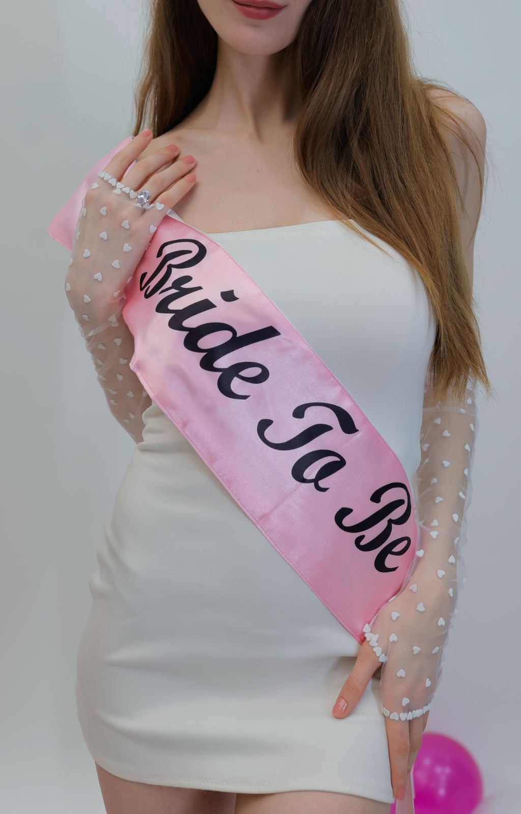 Barbie bride wearing a long fingerless gloves with small white heart on them.