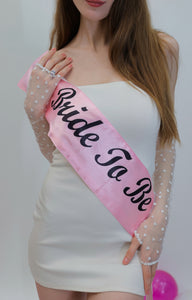 Barbie bride wearing a long fingerless gloves with small white heart on them.